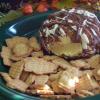 toasted vamilla cheeseball, decadent, rolled in chocolate graham cracker crumbs and drizzled with almond bark